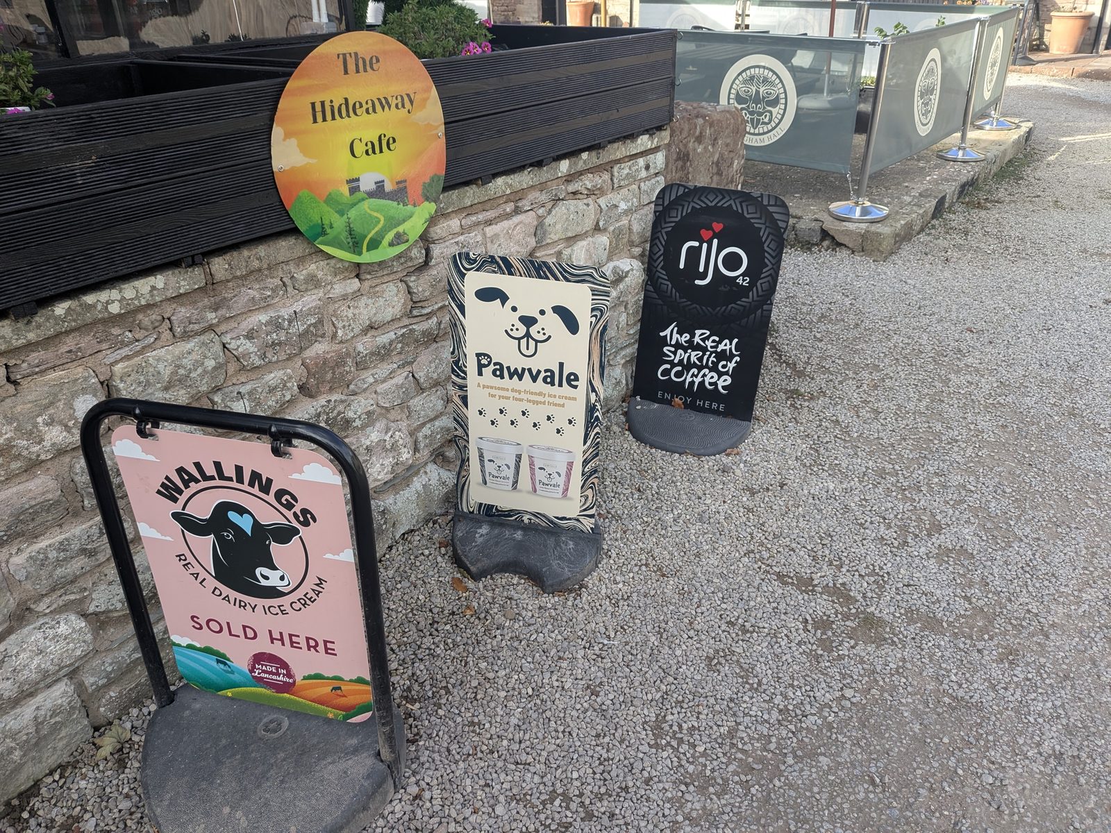 The Hideaway Café sign and A-boards outside the café at Brougham Hall