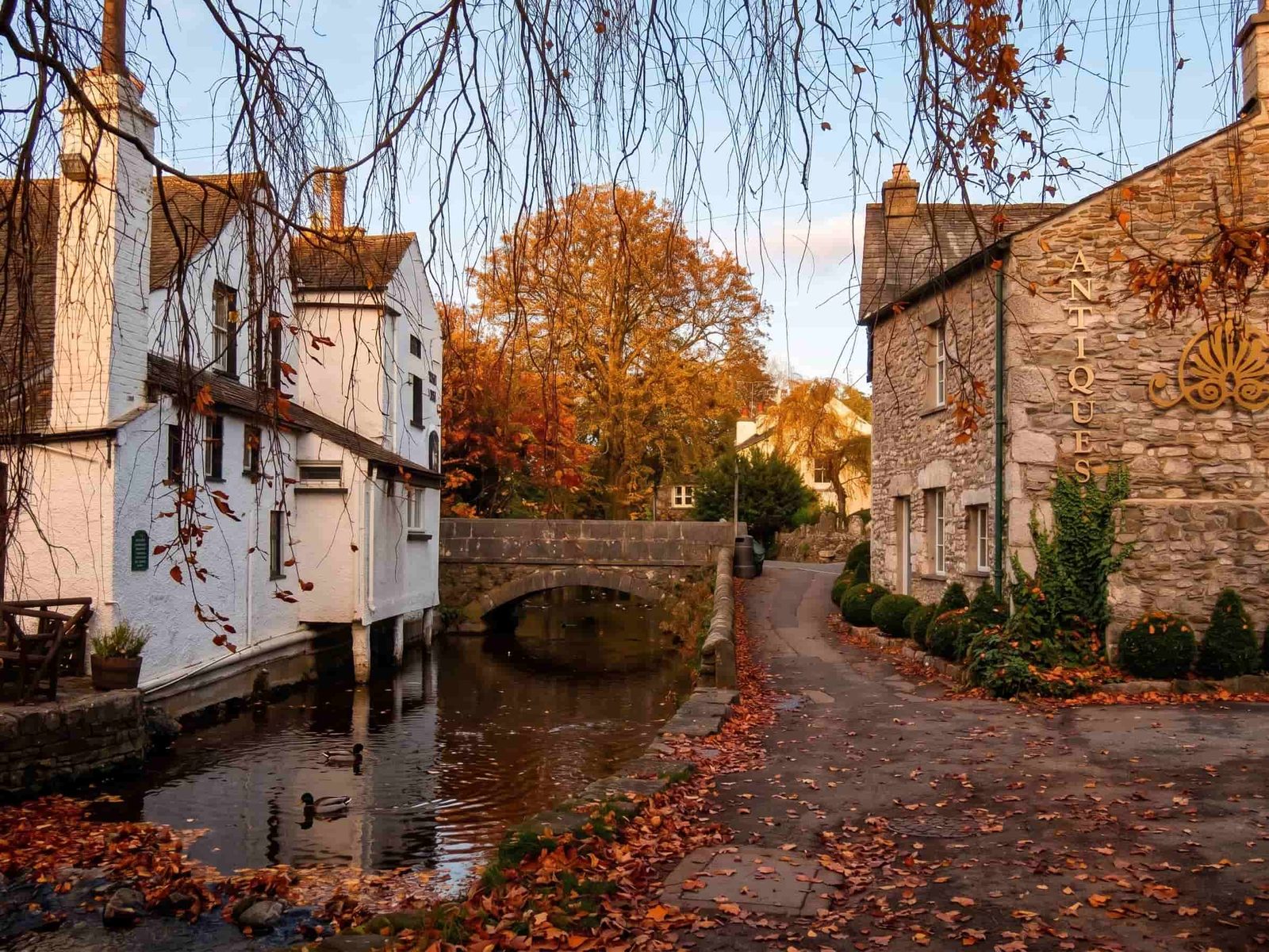 The little stone bridge over the beck in Cartmel village in autumn, Cumbria