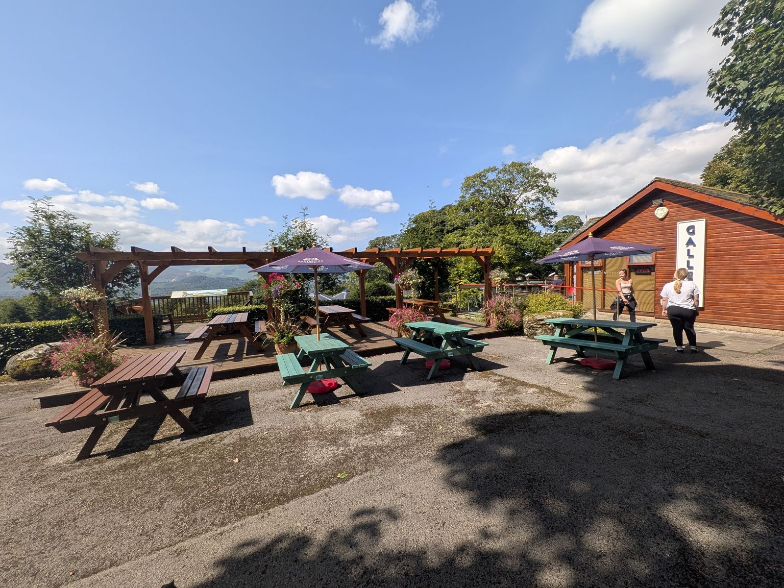 Tea garden at Castlerigg Gallery with picnic benches and fell views