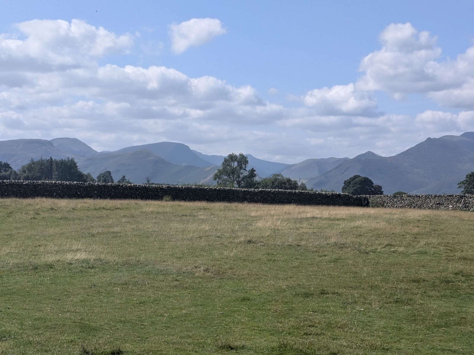Dry-stone wall and the north-western fells seen from the fields at Castlerigg