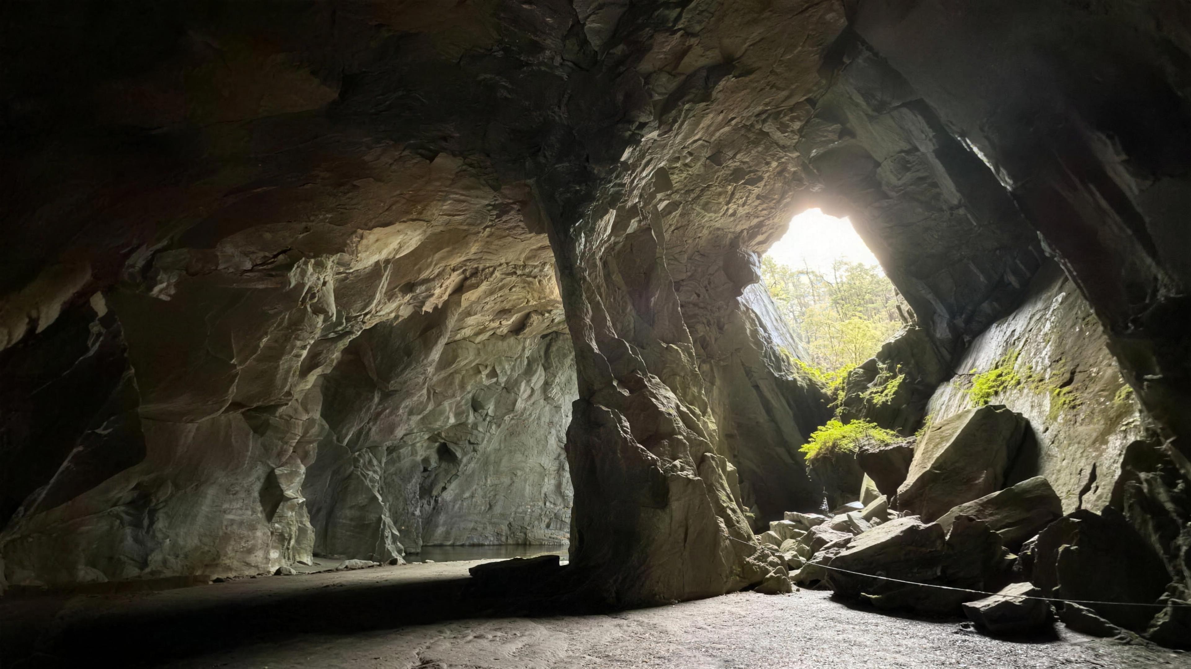 The main chamber of Cathedral Cave, Little Langdale, lit by natural rock windows, Lake District