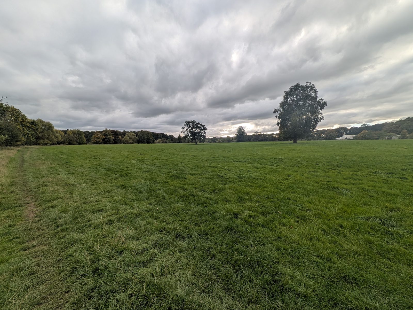 Wide open riverside fields under a cloudy sky on the way back to Eamont Bridge