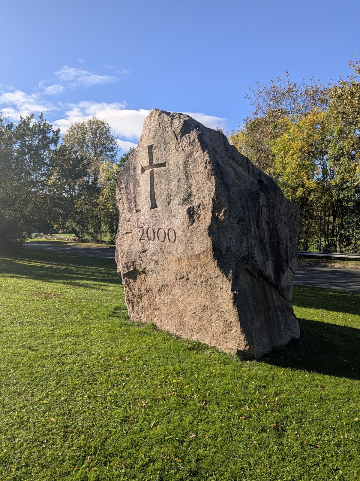 The Eden Millennium Monument near Mayburgh Henge: a large granite block carved with a cross and the number 2000