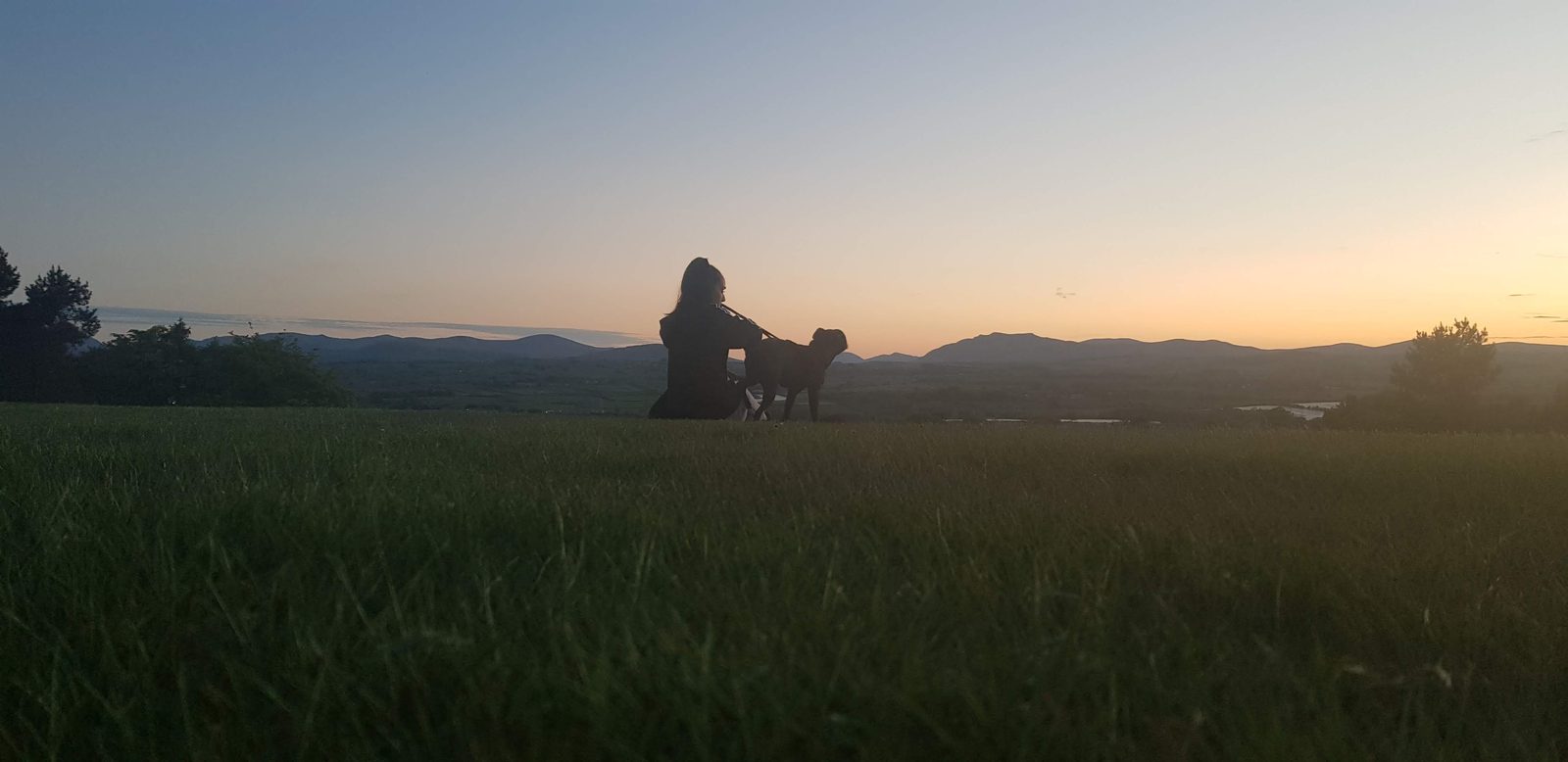 Sunset silhouettes on the golf-course section of the evening circular, the Lakeland fells on the horizon west of Penrith