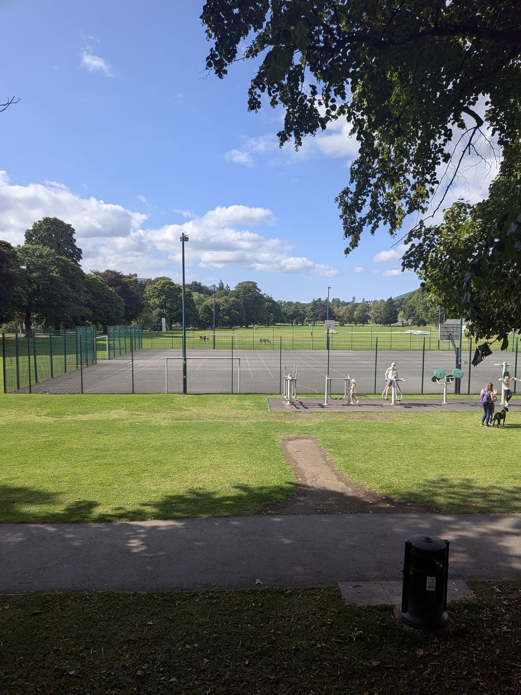 Tennis courts and outdoor gym in Fitz Park, Keswick, with fells beyond