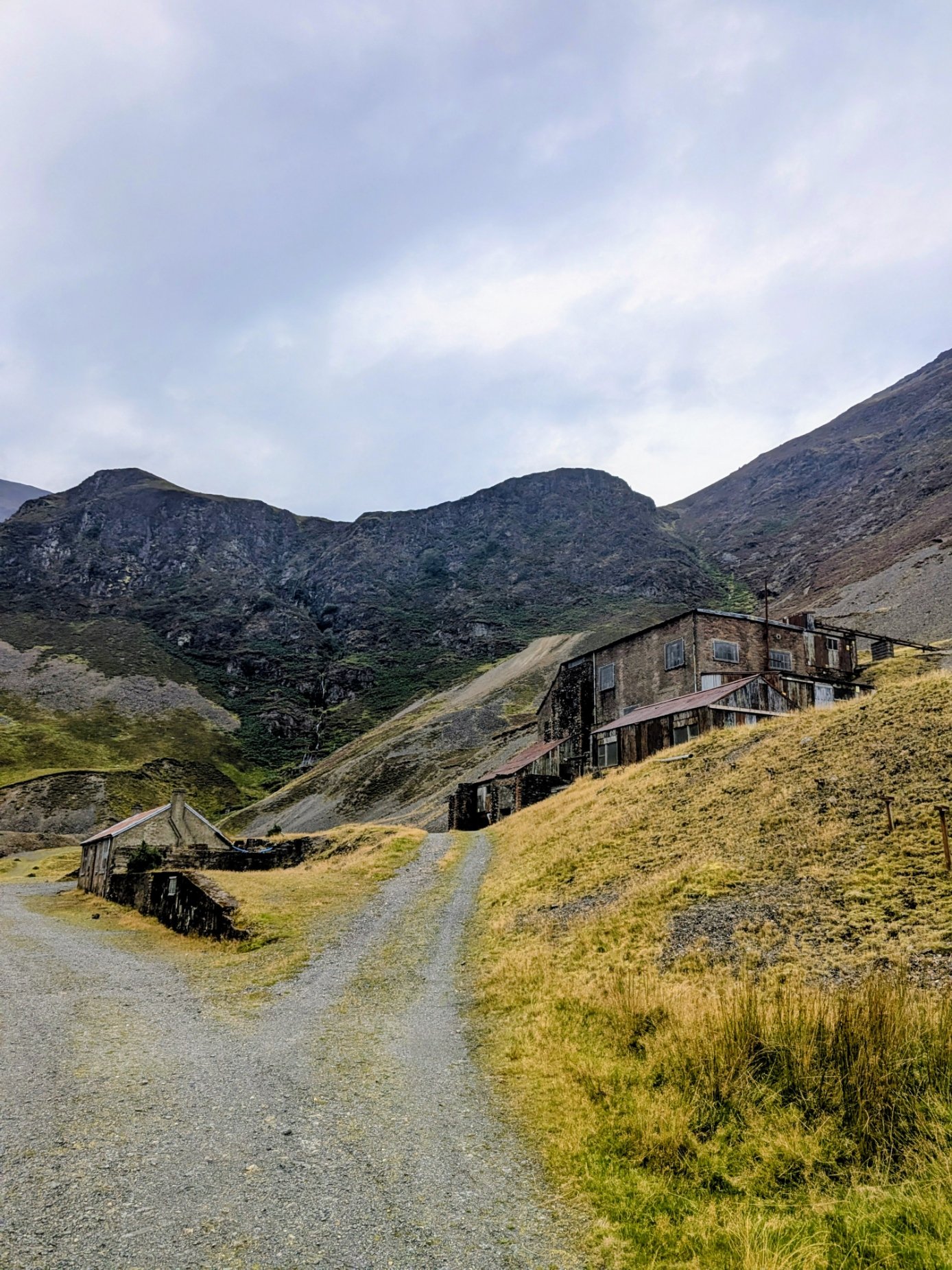 The former processing mill at Force Crag Mine, a large timber and brick building set against the crags at the head of Coledale