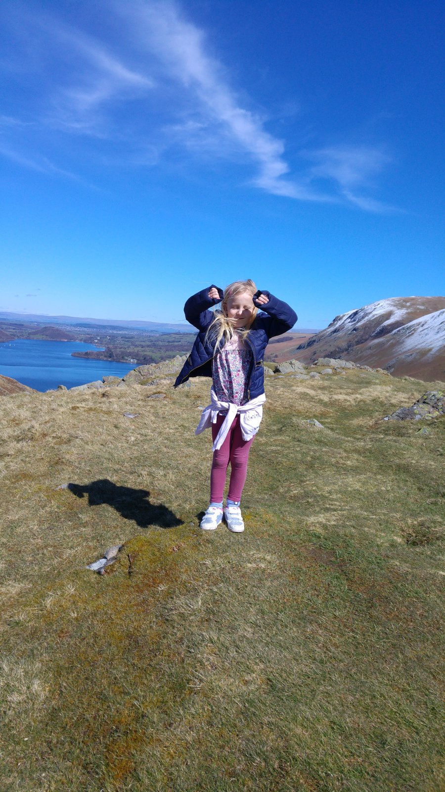A child near the top of Hallin Fell with almost the whole of Ullswater stretching away below