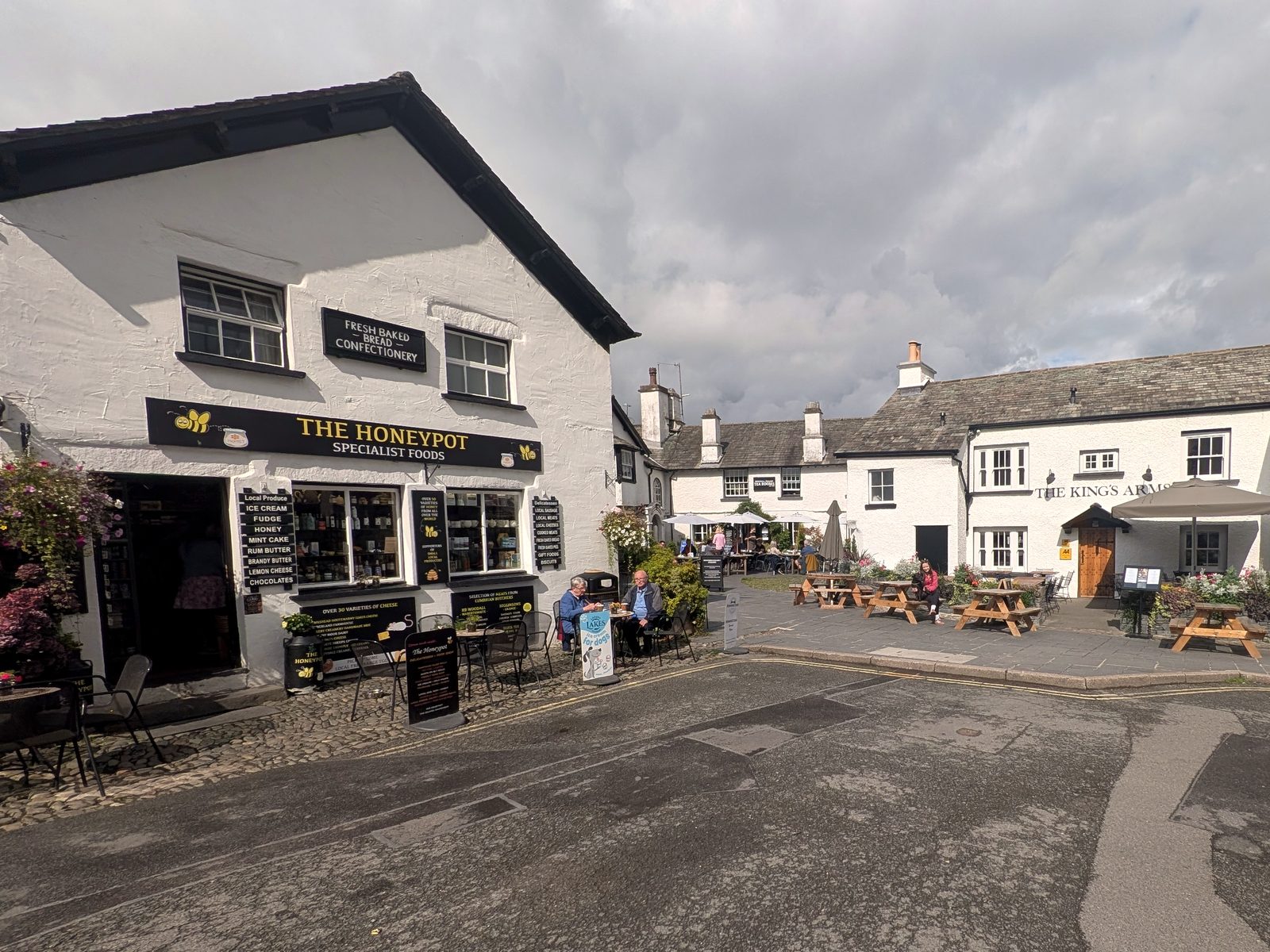 The square at Hawkshead, with the Honeypot and the King's Arms in the sunshine, Lake District