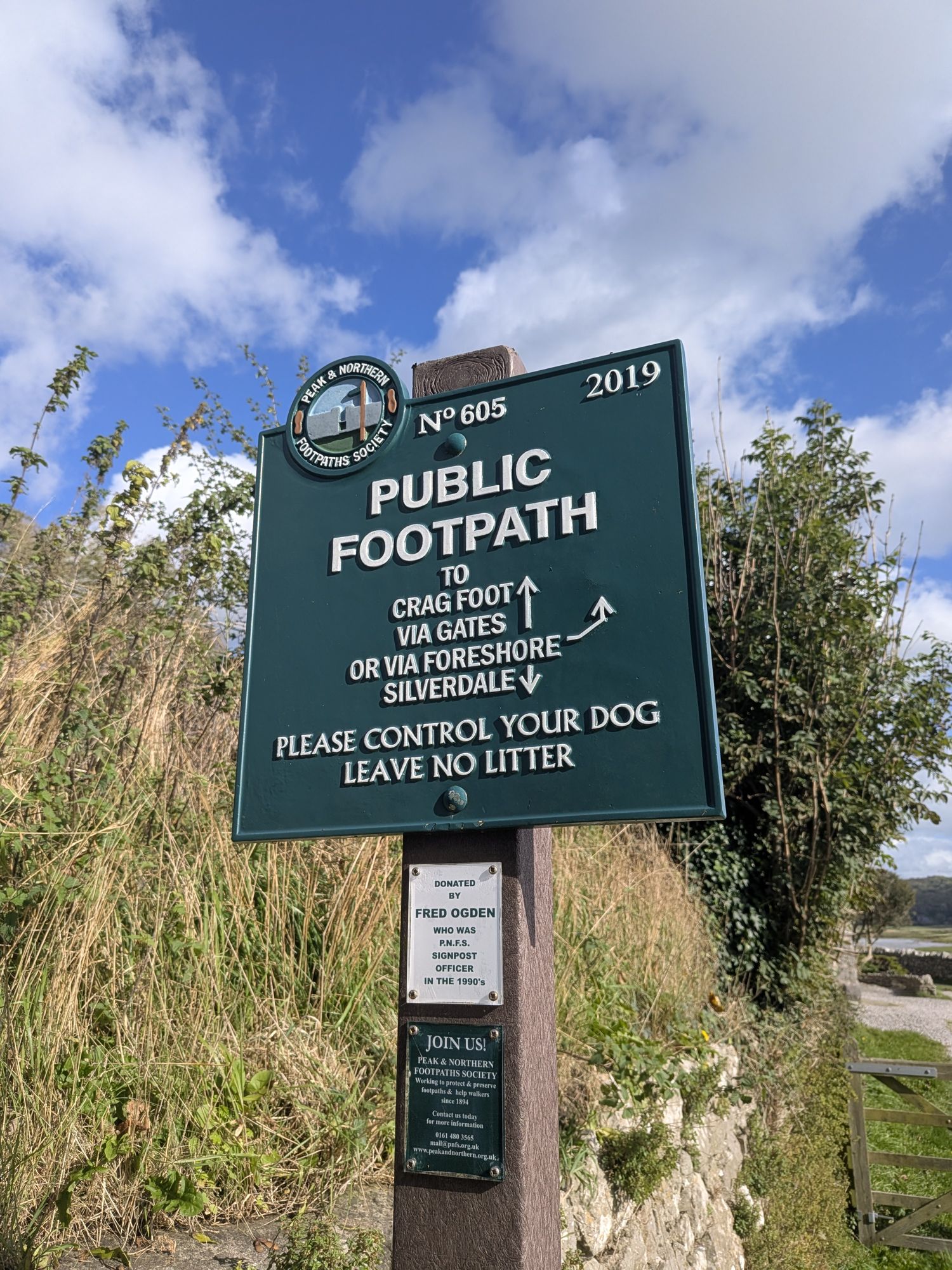Green Peak and Northern Footpaths Society sign number 605 reading Public Footpath to Crag Foot via gates or via foreshore, and Silverdale
