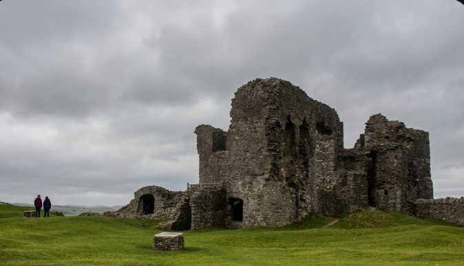 The ruins of Kendal Castle on its grassy hill above the town, Kendal, Lake District