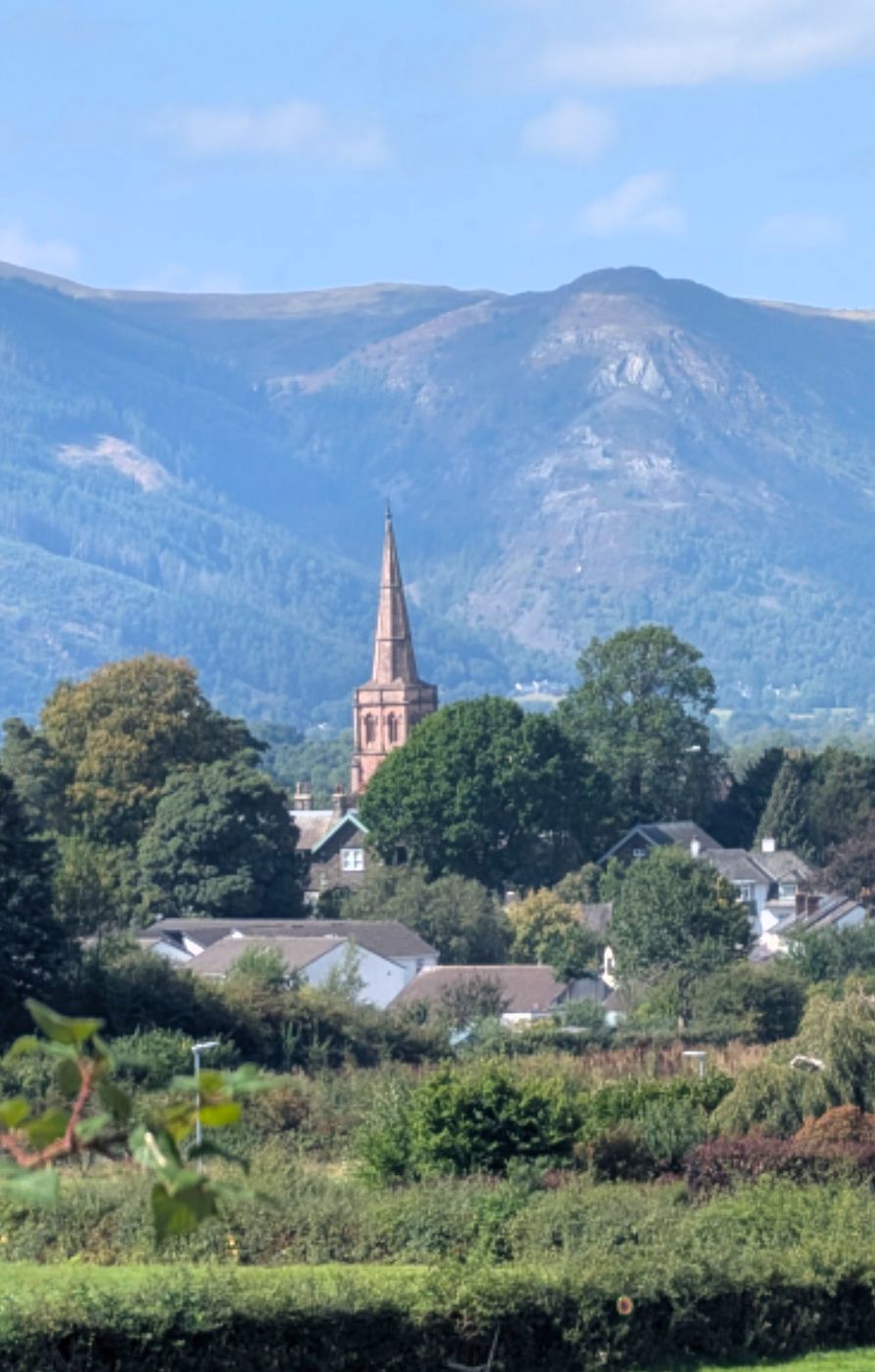 The spire of St John's Church, Keswick, against the fells