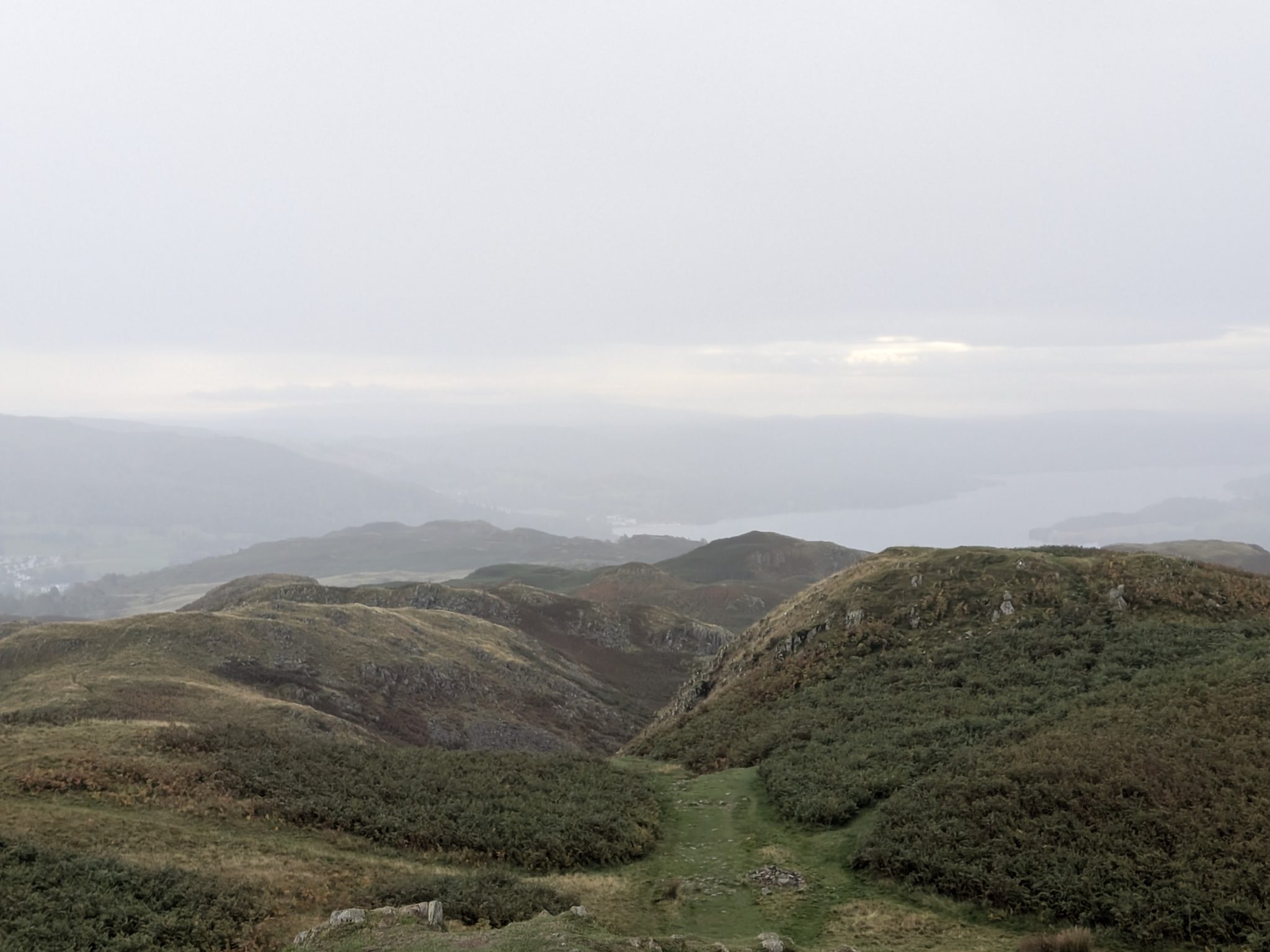 Windermere in the haze, looking south from the summit of Loughrigg Fell