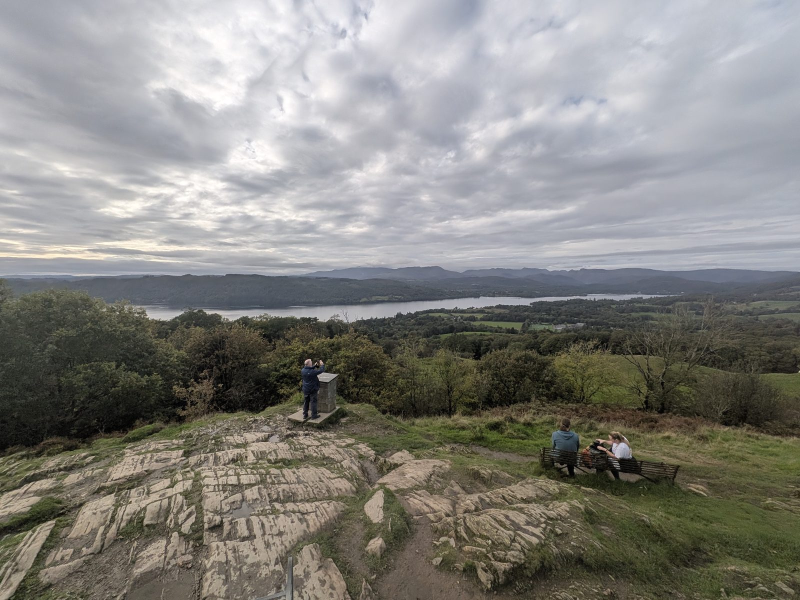 The rock slabs on the summit of Orrest Head, with Windermere behind