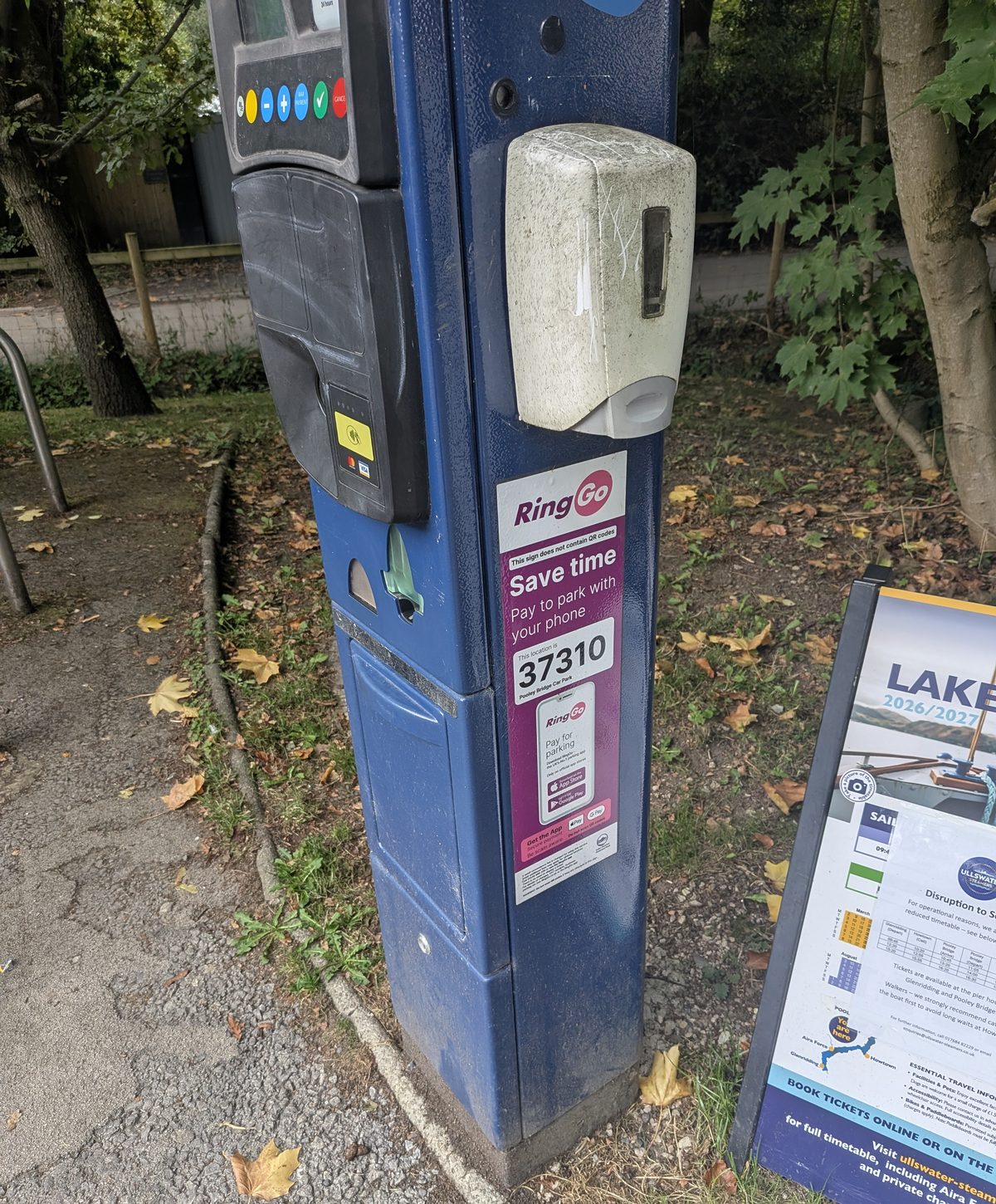 The blue pay-and-display machine in the Pooley Bridge car park, with a RingGo sticker showing location code 37310