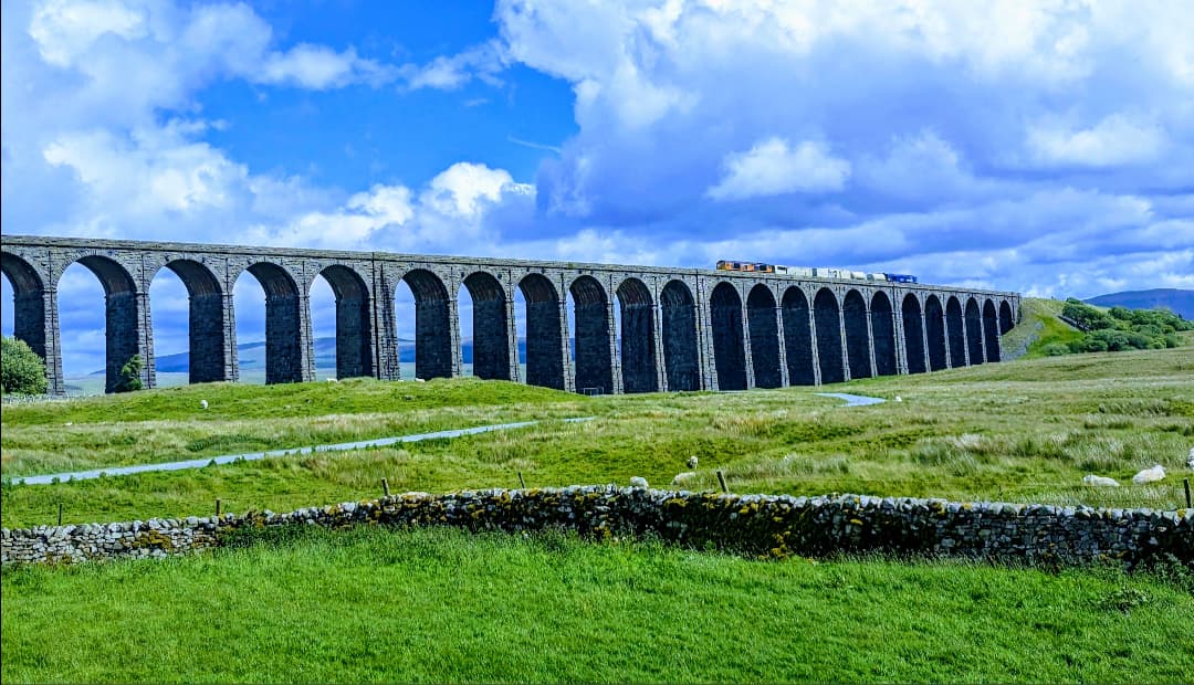 A train crossing the 24-arch Ribblehead Viaduct on the Settle–Carlisle line, Yorkshire Dales