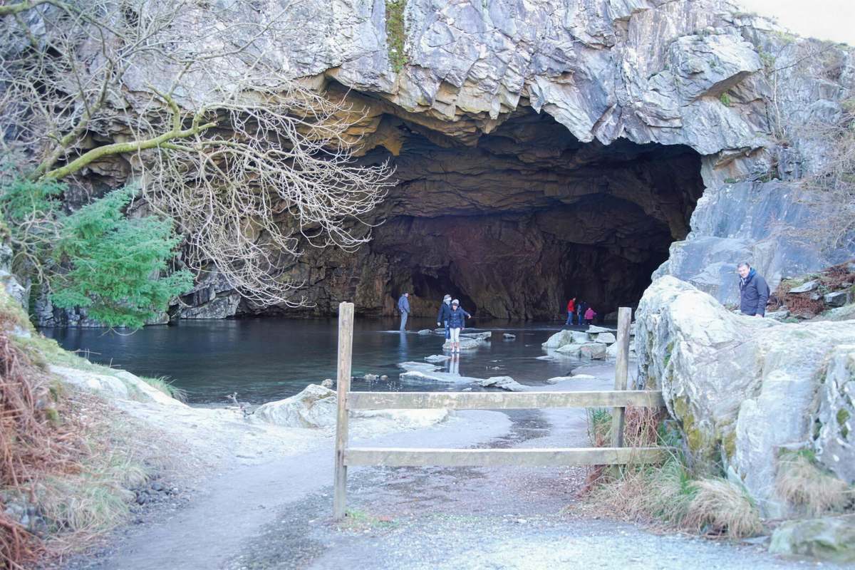 Rydal Cave slate-quarry cavern and shallow entrance pool above Rydal Water, Lake District