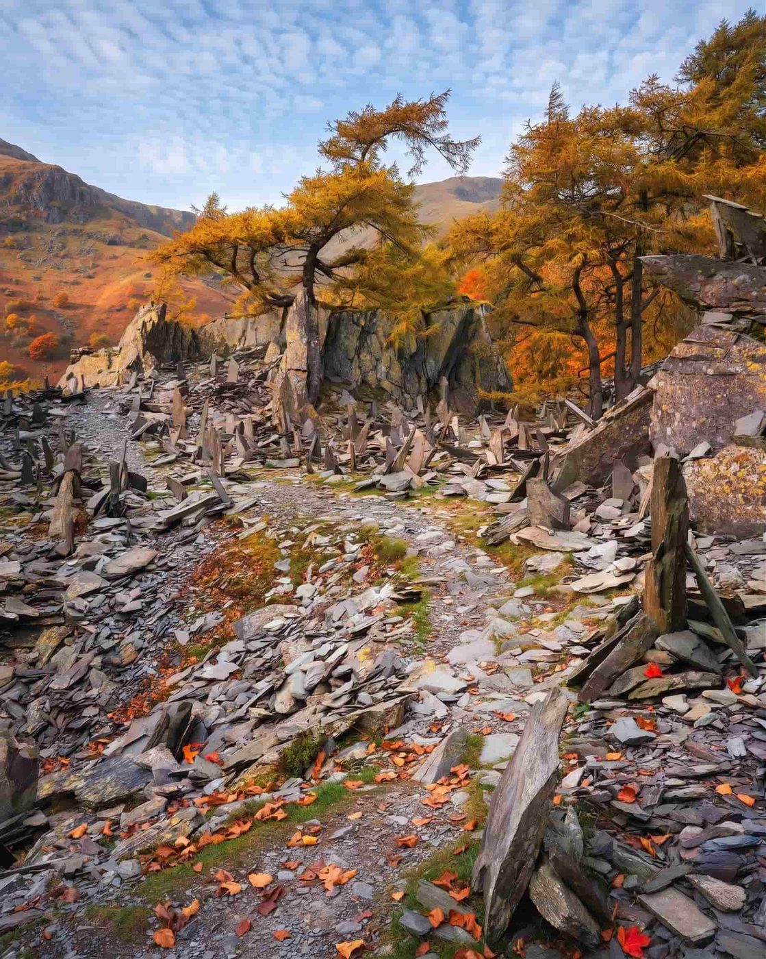 The steep quarry-spoil scree path zigzagging up Castle Crag, Lake District