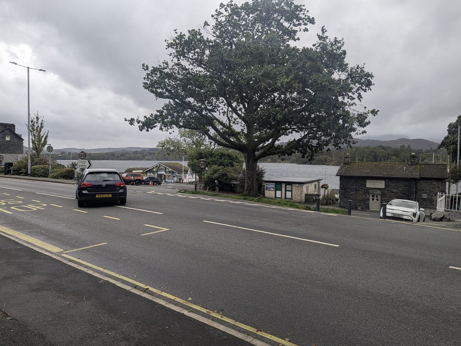 The A591 at Waterhead, with a large tree beside the road