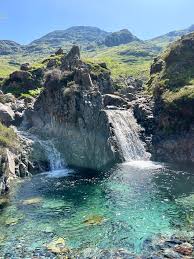 Clear emerald green pool in Wasdale valley, Lake District